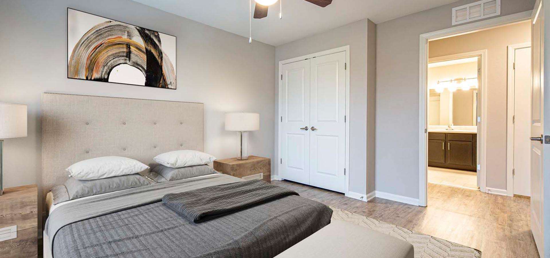 bedroom with vinyl flooring, queen size bed, and high ceiling